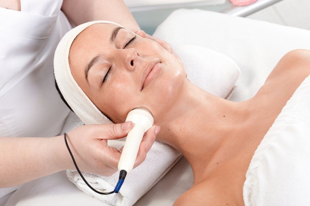 Young woman receiving fractional laser resurfacing treatment